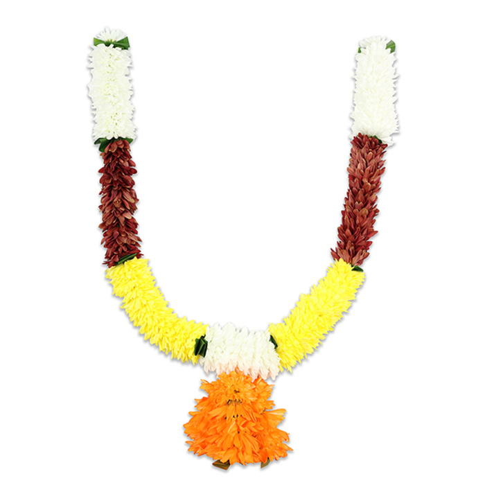 Against a stark white background, a U-shaped artificial floral mala is shown in careful, tactile detail, the sort of ceremonial ornament a local florist would explain to a customer preparing for a festival or wedding in Tufnell Park. The top of each arm begins with a compact column of creamy-white flowers, soft and pillowy like miniature chrysanthemums, giving the garland a pale, luminous beginning. Immediately below, a distinct section of deep reddish-brown adds a textured, grounding band - petals or flattened elements that carry a rustic, almost terracotta quality. From there, the garland curves gracefully into a broad expanse of vivid yellow clusters, densely arranged to emulate marigolds and to create the bright U-shaped body associated with celebration and devotion. Small green highlights are threaded at the junctions, subtle leaf-like accents that tidy the transitions and introduce fresh contrast. Suspended from the meeting point of the yellow curve is a bold central pendant made of many layered, ruffled orange petals; this large, rounded tassel reads as the focal emblem, exuberant and warm. The artificial materials are evident in the consistent, resilient construction - chosen deliberately for repeated use in puja ceremonies, temple decorations, Diwali door hangings, or wedding entrances. The overall effect is of tradition reimagined with practicality: rich texture, saturated colours - white, reddish-brown, yellow and orange - and an inviting weight that would hang proudly above a doorway off Fortess Road or in a Tufnell Park sitting room, offering both festive brightness and cultural resonance.