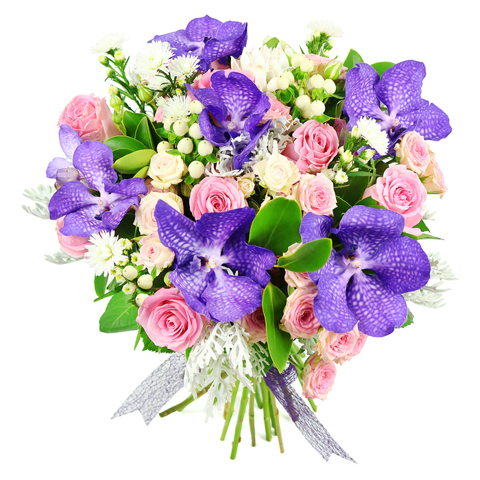 This image showcases a lavish, professionally crafted bouquet set cleanly against a white background, highlighting the skill and detail that go into each stem. Dominating the composition are several striking Vanda orchids, their broad petals drenched in jewel-toned purples and inky blues, overlaid with fine speckling and veining that give an almost marbled effect. They are carefully positioned to draw the gaze around the bouquet, each bloom creating a focal point of exotic charm. Woven among them are classic pink roses in a spectrum of openness: some are still gently cupped, promising scent and beauty to come, while others are wide open, revealing soft spirals of petals that evoke romance and tenderness. Creamy white spray roses fill out the arrangement, their small, clustered blossoms adding lightness and a delicate, bridal quality. Complementing these main elements are clusters of pure white hypericum berries, round and glossy like tiny porcelain beads, and airy sprays of fine white filler flowers that give the design a subtle, lacy halo. Lush dark green foliage gives the bouquet its structure, embracing the blooms and making the colours appear even more vivid. Interspersed are ruffled, silvery-grey dusty miller leaves, whose soft, velvety texture adds a cool, frosted note. The stems are elegantly tied with a semi-sheer silver-lilac ribbon that shimmers gently, echoing the purple tones of the orchids. The bouquet feels at once luxurious and welcoming, like a thoughtful gift carried from a Tufnell Park florist up Junction Road or towards nearby Gospel Oak, perfect for marking anniversaries, graduations, or meaningful thank-you moments with a sense of refined celebration.