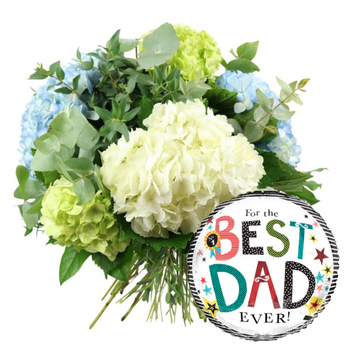 In this clean, uncluttered image set against a bright white backdrop, a hand-tied hydrangea bouquet and a Father's Day balloon come together to create a cheerful gift, as if ready to be dispatched for delivery to a family home near Tufnell Park station. The bouquet, positioned slightly to the left and centre, is full and generously rounded, made up almost entirely of large hydrangea heads. Dominating the front and centre are several creamy white hydrangeas, each spherical bloom built from layers of tiny, delicate petals that give a plush, cushion-like texture. Tucked behind and to the left, soft light blue hydrangeas add a cool, soothing contrast, while around the right side and lower left, vivid lime green hydrangeas inject a lively pop of colour, giving the design a fresh, contemporary edge. The florist has threaded through plenty of greenery: soft, silvery eucalyptus leaves with their characteristic rounded shapes mingle with deeper green foliage, filling in gaps, adding volume, and suggesting a subtle, refreshing scent you might notice as soon as the bouquet is carried through a doorway along Fortress Road. Beneath the blooms, the stems are clearly visible, long, straight, and carefully bundled, showing this is a hand-crafted gift rather than a mass-produced piece. On the lower right of the composition, partially overlapping the stems, sits a shiny round foil balloon. It has a bright white central panel framed by horizontal black and white stripes at the top and bottom, giving it a classic yet playful look. Across the centre, the phrase For the BEST DAD EVER! appears in varied fonts and colours: the words BEST and DAD are bold and patterned, with polka dots, stripes, and solid shades of teal, red, black, and green, surrounded by tiny stars, dots, and a small No. 1 rosette graphic. Together, the cool-toned hydrangeas and jubilant balloon perfectly capture the spirit of celebrating a much-loved father in Tufnell Park, whether for Father's Day, a birthday, or simply to say thank you.