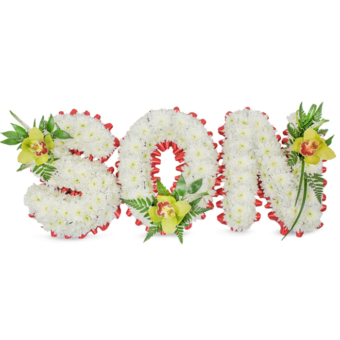 Rendered with quiet precision, this three-dimensional floral tribute spells SON in block letters entirely covered in dense clusters of small white chrysanthemums, giving each letter a sculpted, cushion-like quality. A continuous band of red ribbon is folded into small scallops and threaded around the perimeter of each letter, where its vivid colour provides a crisp, graphic edge against the snow-like blooms. Placed near the hollow of the O and the curves of the S and the peak of the N are three yellow-green Cymbidium orchids with delicate reddish-brown throats; their smooth, waxen petals and the orchids' refined centres draw the eye inward and add a subtle theatricality to the arrangement. Rich green foliage, including slender pointed leaves and soft fern fronds, fans and trails around the letters, introducing texture, movement and a living contrast to the formal letter shapes. The composition is photographed on a plain white surface with soft, diffuse lighting that accentuates the chrysanthemums' tiny radiating petals and the orchids' glossy surface without harsh highlights. Texturally there is a pleasing interplay: the chrysanthemums' matte, ruffled faces against the ribbon's satin sheen and the orchids' satin-smooth petals. Intended for memorial services, graveside placement or a chapel tribute, this arrangement communicates purity, respect and a carefully held affection for a departed son. A florist local to Tufnell Park would consider nearby routes and chapel entryways when constructing and delivering such a piece to ensure the formality and dignity of the design are preserved.