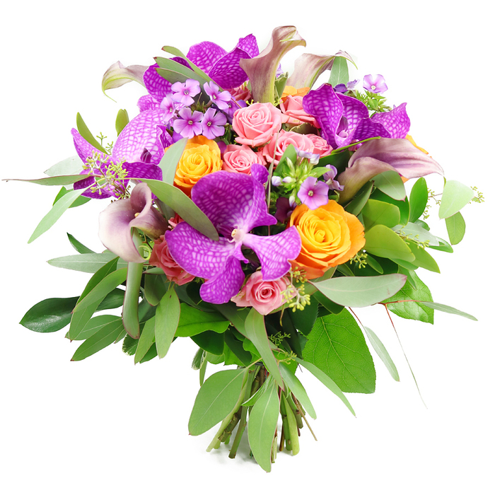 A vibrant, meticulously constructed bouquet is shown in full bloom, suspended against a pure white background that makes every petal and leaf appear crisp and luminous. Dominating the composition are several striking Vanda orchids in intense fuchsia-purple, their petals broad and velvety, patterned all over with tiny, lighter speckles that lend each flower an intricate, almost mosaic-like surface. They sit at different angles so you can appreciate the rounded shape of some blooms and the elegant, outward sweep of others. Cradling these orchids are clusters of vivid orange roses, tightly built with spiralling centres, their colour reminiscent of late-afternoon light over the brick terraces of Tufnell Park. Between them, blush and pastel pink roses soften the palette, some no more than delicate buds with petal tips barely parted, others unfurled into layered, ruffled rosettes that suggest romance and tenderness. Rising slightly above the rounded mass of roses and orchids are several slender calla lilies in a dusty mauve or muted plum shade. Their smooth, trumpet-shaped flowers curl gently at the lips, bringing a sense of graceful movement, almost like a series of small, poised sculptures. The bouquet is framed and filled with abundant green foliage: long, silvery eucalyptus leaves that arc softly around the edge, interspersed with darker, sturdier greens that deepen the composition and hint at a fresh, woodland scent. Tiny lavender-coloured filler blooms and wisps of green accent sprigs tuck into the gaps, adding fine detail and a cloud-like texture. At the base, the cleanly cut stems gather tightly together, revealing a professional hand-tied finish. It is the sort of luxurious yet modern bouquet a local Tufnell Park florist might prepare for a stylish townhouse on Carleton Road, a milestone birthday, or an intimate celebration at home.