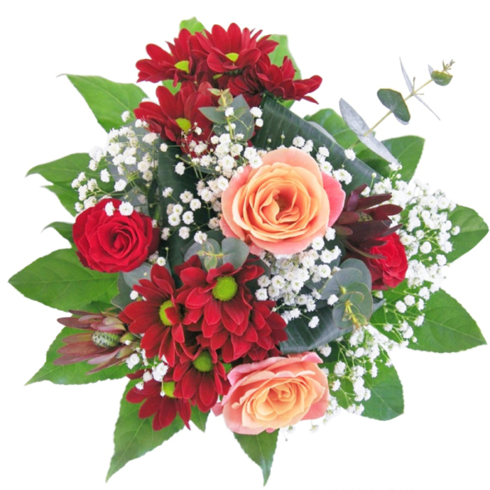 This artful bouquet draws inspiration from the neighbourhood's vibrant personality, with jewelled reds and soft apricots carefully layered to create visual drama. Radiant chrysanthemums and plush red roses form the striking core, their velvety petals catching the morning light much like the blooms in the glasshouses along York Way. Creamy peach roses soften the boldness, introducing a buttery warmth that feels like a gentle embrace. Wisps of white gypsophila nestle between each flower-tiny pearls on a silk ribbon, offering a sense of airiness and depth. The lower half is framed by fresh, glossy leaves, their rich green weaving a tactile border reminiscent of Tufnell Park's leafy lanes. The bouquet sits proudly in a crystalline glass vase, water amplifying every stem and lending clarity to the whole design. There's a palpable sense of touch: from the firm leaves to the delicate petals and airy gypsophila, each texture invites you in. This composition embodies both a florist's mastery and personal intent-crafted for everything from declarations of love to joyful welcomes or stylish home adornment. The overall effect is of a loving embrace, gentle yet bold, perfectly attuned to the thoughtful, artistic spirit of Tufnell Park.