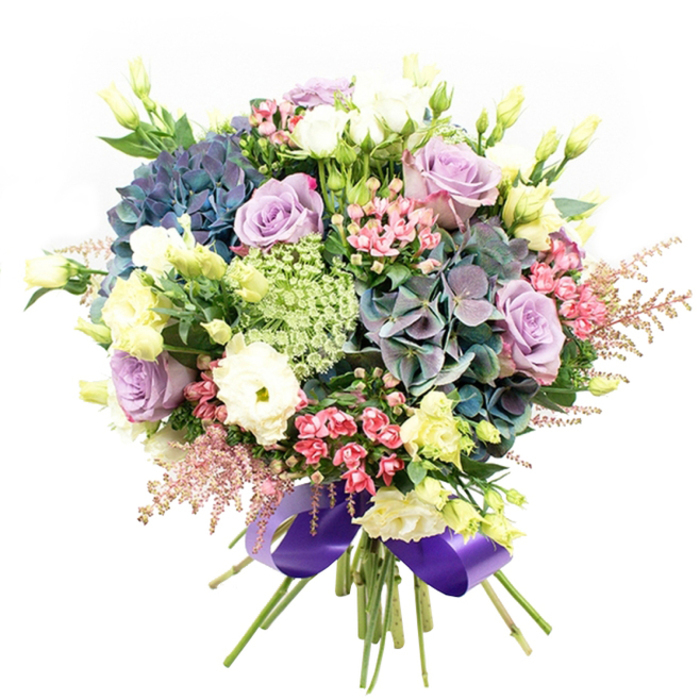 Rich with carefully curated blooms, this opulent arrangement is a true testament to Tufnell Park's love of natural beauty and artistic flair. Bursts of indigo, teal, and soft violet hydrangeas form the base, reminiscent of the lush displays seen at local gardens near Tufnell Park Fields. Among their plush, cloud-like petals, elegant roses reveal themselves in a spectrum from dusky lavender to refined creamy white, their blossoms immaculate and inviting. Cocooned within, white ranunculus offer a subtle, romantic counterbalance with their ruffled, multi-layered petals. Slender yellow eustoma buds rise throughout, while fuchsia-pink filler blossoms and feathery blush-pink astilbe plumes flutter around the outer edges, adding pops of vivid colour and hints of whimsy. Lacy clusters of delicate green and white filler-suggestive of Queen Anne's lace-bring depth and texture to the ensemble, enhanced by foliage in deep, restful green hues that reflect the neighbourhood's greenery. The design is finished with a bold, gleaming royal purple satin ribbon, wrapping the stems in a flourish as refined as the cafés lining Fortess Road. This bouquet, radiating freshness and the scent of garden mornings, calls to mind joyful celebrations or intimate gatherings, and is available for thoughtful delivery throughout Tufnell Park, reflecting the high standards and local care of Flowers Tufnell Park's skilled florists.