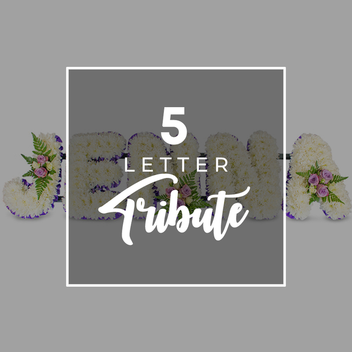 This image presents a dignified five-letter funeral flower tribute, styled with the kind of quiet care you might expect from an experienced Tufnell Park florist preparing arrangements for a local service. Set against a smooth, pale grey background that keeps all focus on the flowers, the letters are arranged in a neat horizontal line, each one built on a sturdy frame and entirely covered with petite white chrysanthemums or carnations. The blossoms are so densely arranged that they form a continuous, cushioned surface, softening the bold shapes of the characters that appear to spell JOHN with an additional letter A at one end. Around the outer edge of every letter runs a precise border of rich purple satin ribbon, its deep tone and gentle sheen lending the design a formal, respectful look that contrasts beautifully with the snowy white petals. At several points along the tribute, small, asymmetrical groupings of pale pink and lilac spray roses break the uniformity, nestled among airy green fern fronds and fresh foliage to introduce hints of colour and garden-like texture. Over the centre rests a semi-transparent square panel of darker grey, framed by a clean white outline and printed with the phrase 5 LETTER Tribute. The word Tribute appears in a graceful script, while 5 LETTER is presented in a modern, uppercase font, clearly signalling that this is an example of bespoke floral letters for a name or meaningful word. The entire scene conveys a sense of tender remembrance and personal storytelling, well suited to a farewell held in Tufnell Park or nearby North London neighbourhoods.