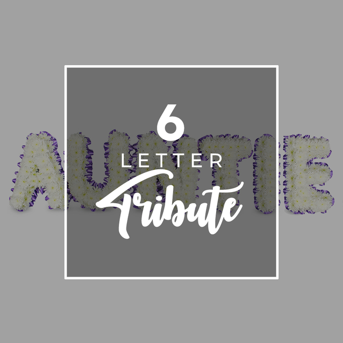 This evocative tribute presents AUNTIE as six freestanding letters, carved from a dense bed of white chrysanthemums. The petals form a soft, almost cloudlike surface that conveys purity, memory, and gentleness. Each letter is outlined with a purple trim-smaller accent blooms or a delicate ribbon-that defines the shape against the calm gray backdrop. A square white frame overlaps the center of the composition. Within it, the text reads 6 LETTER in white on white, with Tribute gracefully scripted beneath, the difference in typefaces signaling both precision and sentiment. The lighting is even and cool, enhancing the bloom texture and the crisp borders of the typography. The overall effect is one of timeless reverence, a bespoke piece that speaks to a family's intimate bond with a loved one. Designed for funerals, wakes, or private remembrances, this Auntie tribute is ideal for families in the Tufnell Park area and the surrounding Camden and Islington communities. It can be delivered locally, with same-day options available to households near Kentish Town, Archway, and Holloway, ensuring the memory can be present where it matters most. Crafted with meticulous care, the arrangement balances softness with formal elegance, inviting quiet reflection and offering a sense of ongoing presence in a room.