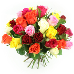 A bountiful bouquet of freshly cut roses fills the frame, its rounded, hand-tied shape set crisply against a spotless white background. The arrangement looks as if it has just been finished on the workbench of a Tufnell Park florist, with each stem placed deliberately to create a flowing blend of colours rather than strict sections. Rich crimson and deep ruby red roses provide a passionate base, while sunny yellows and glowing oranges weave through the design, bringing energy and light. Soft blush and pastel pink roses soften the palette, and splashes of vivid fuchsia add a playful, modern twist. Creamy white and ivory blooms are dotted here and there, quietly brightening the entire bouquet. Some roses are wide open, revealing their layered centres, while others remain in tighter bud form, promising days of unfolding beauty. The petals appear velvety and dense, inviting the imagination to trace their edges, while glossy, dark green leaves emerge between the blooms like small shadows of foliage. Below, the long green stems are carefully aligned and bound with a neat green and white gingham ribbon, suggesting a bouquet ready to be carried along Fortess Road or delivered to a home near Tufnell Park station. The lighting is bright and even, casting soft, natural shadows that give the arrangement volume and depth. This image communicates an uplifting, celebratory mood, ideal for illustrating local flower delivery for birthdays, romantic gestures, or heartfelt thank-you gifts within the Tufnell Park area.