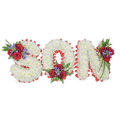 This sombre, lovingly made floral tribute spells SON in three-dimensional capital letters, each letter formed from a dense, cloud-like mass of small white chrysanthemums that read as softness and serene purity. A vivid red satin ribbon frames each character in a scalloped border, its smooth sheen creating a striking outline that contrasts with the chrysanthemums' matte texture and neatly defines the letterforms. The arrangement is punctuated at three precise points - the top left of the S, the bottom centre of the O, and the top right of the N - with compact sprays of velvety deep red roses, their petals opening like a quiet pulse of memory. Between and beneath the roses rise narrow, spiky blue-purple stems (resembling Liatris or similar spikes) that add vertical structure and a cool colour chord, while lush dark green leaves and soft fern fronds trail gently to give depth and verdant framing.

Seen in gentle, diffused light, this piece reads as thoughtful and restrained, a traditional but personalized expression of grief and love intended for a funeral, wake, or graveside service. The white chrysanthemums symbolise peace, the red roses express enduring affection, and the blue-purple accents offer a note of reflective calm. Prepared with the care of local hands, this tribute can be arranged by Flowers Tufnell Park for delivery to services across Tufnell Park, Kentish Town and Archway, and its craftsmanship reflects the neighbourhood's quiet respect for ceremonial floristry.