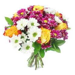 A lush mixed bouquet fills the image from edge to edge, set sharply against a spotless white background that makes every colour sing, as if the flowers were just carried from a Tufnell Park flower stall on a bright morning. Dominating the centre are several luxurious bi-colour roses, their petals spiralling out from sunny golden cores into layers of warm orange and subtle burnt-red tones, giving a sense of warmth and quiet romance. Around and between them, white daisy chrysanthemums with striking lime-green centres create a clean, almost sparkling contrast, their tidy petals forming starbursts of light that echo the freshness of nearby Tufnell Park Station on a crisp spring day. Nestled more deeply in the arrangement are rounded heads of magenta and fuchsia chrysanthemums, densely petalled and cushiony in texture, their yellow-green centres mirroring the daisies and adding a rich jewel-toned depth to the bouquet. Dark, polished green foliage threads through the blooms, offering a gentle frame and a sense of natural movement, like leaves stirred by a breeze on Carleton Road. The bouquet is tied neatly at the base, with a cluster of green and tan stems fanning slightly where they meet the tabletop, showing off the clean cuts and professional hand-tied technique of a skilled local florist. Soft, even lighting falls across the flowers, highlighting the velvety rose petals, the crisp daisy faces, and the intricate chrysanthemum textures. The overall effect is joyful yet refined, a bouquet that feels perfect for celebrating milestones, sending congratulations, or welcoming someone to a new home in and around Tufnell Park with a vivid splash of colour and life.