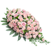 A serene pink casket spray is shown resting on a stark white surface, its shape forming a graceful teardrop that feels both traditional and gently modern. The arrangement is lavishly filled with soft pink and light peach-pink roses and carnations, so closely arranged that the blooms seem to touch and lean into one another, creating a sense of unity and shared comfort. Large, open roses reveal intricate spirals of velvety petals, while smaller buds hint at stories left to be told. Interspersed throughout, ruffled carnations in complementary blush tones add volume and a slightly frayed, cloud-like texture that softens every line. The flowers sit upon a structured bed of dark green foliage, with thick, glossy leaves framing the upper curve and sides, grounding the pastel colours and giving a feeling of stability. From the slender pointed end of the spray, finer sprays of greenery and trailing leaves extend outward, lightly cascading as though stirred by a gentle breeze, emphasising the flow of the design from fullness to delicacy. The lighting is calm and uniform, reflecting off the petals just enough to suggest their natural freshness, as if they had only recently been arranged. This sympathetic floral piece could easily be imagined placed on a casket in a Tufnell Park chapel or set near a memory table after a gathering in a home off Brecknock Road, offering a visual expression of quiet farewell, tenderness, and support. Its combination of blush blooms and rich foliage creates a peaceful presence, comforting for families saying goodbye in the calm streets around Tufnell Park.