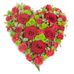 A beautiful, full heart-shaped floral tribute is presented against a simple white backdrop, allowing its rich reds and lively greens to stand forward with emotional clarity. The heart is entirely covered with flowers, giving a sense of abundance and care. At intervals across the design, large deep red roses rise slightly above the other blooms, their petals tightly layered and velvety, representing moments of profound love and gratitude. Filling the spaces around them are numerous red carnations and mini carnations, each small bloom with gently frilled edges that merge together into a soft yet intense carpet of scarlet. Dotted among the red flowers, bright lime-green button chrysanthemums sit like little jewels, their rounded, cushion-like heads providing pockets of light and freshness that balance the arrangement visually and symbolically. The edges of the heart are softened and defined by small sprigs of variegated pittosporum, their green-and-cream leaves offering a delicate, natural frame. Towards the pointed tip at the bottom, a few graceful fern fronds emerge, their darker green tones suggesting depth and grounding. The overall design appears expertly arranged and freshly made, as if completed by a local florist in Tufnell Park for delivery to a nearby church, crematorium, or family home. The composition feels both classic and contemporary, with its bold colour contrast and clean silhouette, and it gently evokes themes of lasting love, heartfelt condolence, and respect. This heart-shaped arrangement would be especially fitting as a tribute at a funeral or memorial service, offering a quiet yet powerful message of remembrance within the Tufnell Park community.