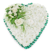 A refined heart-shaped funeral tribute is pictured on a pristine white background, its contours perfectly traced by a rich emerald green satin ribbon that has been pleated into soft, decorative ruffles. Filling the entire interior of the heart, a tightly packed mass of white chrysanthemums forms a thick, cushion-like surface, each floret opening into a rounded cluster of petals. This uninterrupted field of white feels tranquil and pure, evoking the quiet, reflective atmosphere often found in Tufnell Park's churches and crematorium chapels during a farewell service. In the upper left curve of the heart, a thoughtfully composed accent arrangement rises gently from the chrysanthemum bed. Two full-bloom white roses sit at the centre of this cluster, their petals elegantly layered and slightly curled, conveying tenderness and unwavering love. Around them, smaller white flowers-similar to freesias or fine filler blooms-add intricate detail and a touch of softness, while closed buds hint at unspoken memories and ongoing affection. The roses and smaller blooms are surrounded by layered greenery: glossy, dark green leaves and airy, feathery fronds that fan out and occasionally trail over the white base, giving the design a natural, garden-like feel. The lighting is bright but gentle, illuminating the satin sheen of the ribbon and the texture of each petal without harsh glare, creating an overall sense of balance and calm. This floral heart, carefully arranged by skilled local florists for families in the Tufnell Park area, is intended for display at a funeral or memorial, speaking quietly of sympathy, gratitude, and the lasting imprint of a loved one's life.