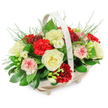 A tender funeral flower arrangement overflows from a light-toned wooden basket, photographed against a bright white backdrop so that every colour and texture stands out clearly, much like a carefully placed tribute in a quiet Tufnell Park chapel. The basket itself is low and oval with a natural, almost birch-like finish, balanced on small feet and crowned by a slim, arched handle that adds a touch of rustic elegance without distracting from the flowers. Inside, the blooms are densely yet thoughtfully arranged into a rounded, cushion-like dome, giving the impression of softness and comfort. Creamy white roses appear throughout, their fully opened, layered petals creating a feeling of peace and pure remembrance. Deep red carnations, rich and ruffled, cluster between the roses, their velvety texture adding depth and a note of soulful warmth suited to a farewell. Interspersed among them are gentler pink and bi-coloured carnations, where white petals are kissed with pink and soft red at the edges, offering subtle variation and emotional nuance. There are also smaller, dainty white blossoms with slender stems and open, bell-shaped flowers that resemble freesias, adding lightness and a hint of fragrance to the design. A base of glossy, dark green leaves cradles the composition, while delicate, feathery foliage peeks out from the top and sides, creating an airy frame around the blooms. The arrangement feels composed and respectful, the sort of piece a local florist might prepare with great care for funeral services or sympathy deliveries to homes and gathering places across Tufnell Park, quietly expressing love, condolence, and support.