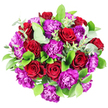 Full overhead shot of a round, hand-crafted bouquet placed on a pure white surface, the flowers forming a tight, generous dome that completely fills the frame. The eye is immediately drawn to the abundance of deep red roses, each one fully open, revealing a perfectly spiralled heart of velvety petals that seem to glow with intensity. Between these classic blooms, bold purple carnations spill over with ruffled petals, their frilly edges catching the light and creating a sense of movement and texture within the design. The combination of crimson and rich purple feels dramatic and indulgent, like a bouquet designed to mark a truly special moment. Around and between the flowers, a careful selection of greenery adds depth and structure: glossy dark-green leaves provide a lush, polished backdrop, while scattered sprigs of eucalyptus introduce a fresher, silvery-green hue that softens the strong colours. The lighting is bright and even, reminiscent of clear daylight in a calm Tufnell Park interior, allowing each tone and texture to be clearly defined without harsh shadows. There is a sense of balance and intention in the way every stem is placed, reflecting the steady hand and trained eye of an experienced local florist. This bouquet could easily be imagined gracing a romantic table in a home near Tufnell Park Fields or arriving as same-day delivery to a loved one in nearby Archway, carrying with it a message of admiration, heartfelt thanks, or deep affection. The overall impression is one of rich, celebratory beauty wrapped in a timeless, modern style.