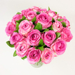 A generous, rounded bouquet of roughly two dozen fresh pink roses sits in a simple clear glass vase, presented against a clean, evenly lit white background. The photographer's slightly elevated, overhead viewpoint reveals the dense, almost dome-like shape formed by closely packed blooms, each rose opening to reveal velvety layers of petals. Colour moves across the bouquet in a soft gradient: some hearts glow with a rich fuchsia or magenta, while outer petals soften to rosy pinks and pale blush cream at the edges, giving each flower depth and a gentle, painterly movement. Dark green, glossy leaves are tucked throughout, their cool, living tones creating visual pockets of contrast that make the pinks read as fresher and more luminous. The lighting is diffuse and soft, erasing harsh shadows and lending the petals a satiny sheen that suggests a faint, powdery rose scent just waiting to be inhaled. The tactile sense is immediate in the description-smooth, velvety petals, the reassuring weight of the glass vessel, and the subtle crispness of the foliage. This arrangement reads as joyful and romantic, suitable for anniversaries, Mother's Day, birthday celebrations, or as an intimate thank-you. As a neighbourhood florist familiar with Tufnell Park's quieter corners, I imagine this bouquet brightening a kitchen table on Tufnell Park Road or arriving as a thoughtful gift at a home near Dartmouth Park; its presence is elegant without being showy. The composition and colour harmony make it a timeless choice for anyone seeking classic beauty with an artisan's touch.