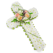 A beautifully composed floral cross, photographed against a pure white background, conveys the solemn grace often chosen for funeral services in Tufnell Park and nearby areas. The main structure of the cross is completely covered in tightly clustered small white chrysanthemums, each bloom fitting closely to the next to form a plush, soft-looking surface that feels both peaceful and pure. Running neatly along the edges, a slim trim of vivid green foliage and floral detail draws a clear outline of the cross, emphasising its traditional Christian shape while adding a fresh, natural contrast to the expanse of white petals. At the centre, where the arms intersect, a slightly raised focal arrangement brings warmth and gentle colour: full, open roses in shades of soft peach, tender blush pink, and creamy ivory sit together, their rounded heads and layered petals suggesting affection and cherished memories. Surrounding them, airy fern fronds, elegantly looping blades of bright green grass, and tiny purple accent flowers mingle to create depth and a sense of organic movement. The overall lighting is soft and even, with no distractions, allowing the viewer to focus on the quiet beauty of the tribute itself. It is easy to imagine this cross carefully delivered to a chapel, crematorium, or family home near Tufnell Park for a service of farewell, offering a symbolic expression of faith, solace, and eternal rest to those gathered in remembrance.