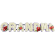 A beautifully composed funeral tribute spells out GRANDMA in large, upright letters, arranged in a straight line against a plain white background, evoking the calm setting of a Tufnell Park chapel or funeral home. Each letter has been meticulously filled with pure white cushion chrysanthemums, their dense, rounded blooms creating a plush, uniform surface that feels soft and comforting. Around the outer edge of every character runs a subtle trim of pale lilac or light purple ribbon and petals, gently outlining the shapes and adding a touch of colour that feels both peaceful and refined. The tribute is enriched with carefully placed red accents that draw the eye and speak of love: the G holds a cluster of deep red roses, paired with a distinctive red-and-white calla lily that curls elegantly from the white base. The first A features a single heart-shaped red anthurium nestled at its base, its high-gloss surface standing out beautifully against the softer textures. In the centre, the M is adorned with more red roses and another red anthurium, and the last A repeats this idea with one final anthurium bloom, creating a gentle rhythm of red highlights across the tribute. A discreet dark green frame supports the letters, barely visible beneath the flowers. The overall design feels tender, respectful, and very personal, the kind of custom arrangement a local Tufnell Park florist might prepare for families in nearby streets such as Brecknock Road or Fortess Road, offering a meaningful farewell to a cherished grandmother.