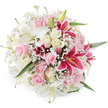 This image shows a sumptuous, rounded bouquet of fresh lilies, roses and baby's breath, photographed from slightly above against a perfectly white, uncluttered background, so all attention rests on the flowers themselves. Broad white lilies anchor the arrangement, their open trumpets and partially closed buds mingling to suggest both fullness and new beginnings, each bloom displaying creamy throats and delicate yellow stamens. Clustered among them are layers of pastel pink roses and rich cream roses, their petals tightly packed and velvety to the eye, transitioning from small, hopeful buds to generous, fully blown blossoms that seem to invite touch. Punctuating this softness, vivid fuchsia or magenta Oriental lilies stand out with their saturated colour and characteristic speckled patterning, deepening to near-burgundy around prominent golden anthers, adding an unmistakable focal point to the design. All around and in between, airy sprays of tiny white baby's breath flowers create a fine lattice, filling negative space and lending a light, romantic haze. Subtle glimpses of glossy green foliage support the composition, offering structure and a whisper of garden freshness. Illuminated by bright, even lighting, the whites appear crisp, the pinks tender and the magentas gloriously intense, as though the bouquet has just been completed by a Tufnell Park florist after a morning visit to the flower market. This arrangement feels ideal for a joyous celebration in a North London home near Kentish Town or for sending love and support to a friend in Tufnell Park, capturing both elegance and heartfelt emotion in one expertly crafted design.