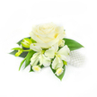 Set against a clean, luminous white background, this petite corsage reads as a study in quiet refinement. At its heart sits a single, fully opened creamy white rose whose many velvety petals curl inward and then unfurl in soft concentric layers, catching gentle shadows that give the bloom a rounded, tactile depth. Flanking the rose are two lily-like alstroemeria blossoms with slightly elongated, ivory petals that arc outward with delicate grace; nearby a pair of narrow green buds promise future openings and introduce a sense of natural rhythm. Tucked beneath and between these larger blooms are clusters of tiny white daisy-like flowers with pale yellow centres, their petite faces adding an intimate, meadow-like detail to the composition. A carpet of deep, glossy green leaves forms a structured, verdant base, their smooth surfaces and bold tone amplifying the creamy whites above.
On the right, a small cluster of lustrous white pearls rests nestled into the foliage like heirloom jewellery, lending a bridal sparkle and the suggestion of a wrist corsage or formal accessory. The overall lighting is soft and even, allowing texture and form to speak clearly, as though arranged on a table in a calm Tufnell Park morning. This piece would sit comfortably at a wedding, prom or special celebration in north London - thoughtful, understated and expertly balanced; it evokes the gentle hush before vows and the close-up scent of petals warmed by soft daylight near Junction Road and Fortess Road.