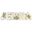A profoundly tender name tribute reads JENNA in bold, three-dimensional block letters arranged horizontally on a pristine white background. Each letter is built from a dense sea of small, creamy white chrysanthemums or similar delicate florets, their tightly packed heads forming a soft, cloud-like surface that suggests both comfort and quiet dignity. A slender ribbon of deep purple or soft lilac traces the inner edges of every letter, providing a gentle line of colour that gives each shape crisp definition against the white field. Thoughtfully placed accent clusters lift the design: a small spray of blush-pink and lavender spray roses nestles into the curving top of the J, another delicate cluster adorns the middle of the first N, and a final grouping of pale cream roses and fern fronds crowns the upper right of the A. These miniature posies add warmth, subtle scent and the dark green of fresh ferns to balance the pale palette.
The letters are subtly connected by fine, dark support bars at their bases, a reminder of careful floral engineering that keeps the tribute unified for viewing at a funeral or memorial. Soft daylight plays across the petals, revealing texture and shadow while the overall mood remains respectful and serene. As a local florist piece made for Tufnell Park families, the composition speaks of personal remembrance and quiet admiration - a handcrafted, name-based tribute that reads as both an intimate memorial and a calm visual embrace for those gathered to remember a loved one.