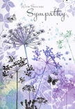 Opening this sympathy card is like stepping into a quiet, twilight meadow imagined just beyond the streets of Tufnell Park, where the city hum fades into a soft, reflective hush. Airy silhouettes of wildflowers rise in elegant curves, their fine stems and rounded umbels drawn in gentle shades of lavender, indigo, and cool blue, anchored by whispers of soft green. The blooms themselves feel almost weightless, with intricate, feathery forms that appear to catch and hold an invisible light, suggesting the last glow of evening above nearby residential roofs. Behind them, the background dissolves into a dreamy blend of watercolour washes-pale violet melting into bluish grey and muted sage-creating a sense of depth without any sharp lines, as if the flowers are emerging from memory rather than a solid landscape. Scattered across this misty backdrop, a few pale petals and leaf impressions drift like distant thoughts. Here and there, butterflies linger near the blooms, their wings delicately outlined and semi-transparent, evoking the quiet idea of transformation and a loved one's ongoing presence. The entire palette is cool yet deeply comforting, reminiscent of a calm stroll along Tufnell Park's quieter avenues after rain, when the pavements glisten and the air smells clean. In front of this soothing scene, the simple message of sympathy would sit naturally in fine script, its sincerity echoed by the tenderness of the illustration. Crafted with the same care we bring to condolence arrangements for local families, this card offers a respectful, nature-inspired embrace-gentle, dignified, and attuned to moments when words alone feel too small.