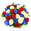 A rich, domed cluster of roses fills this image, arranged so closely that the blooms seem to form a single, plush cushion of colour. Around three dozen roses, each fully open, display a striking patriotic palette of deep red, clear white, and intense cobalt blue, carefully distributed so that all three shades repeat evenly across the bouquet. The red roses provide a warm, velvety depth, the white roses bring a luminous clarity, and the blue roses introduce a bold, contemporary note, together creating an image that feels both classic and modern. The petals are thick and satiny, curling out from tight centres in layered spirals that catch the light, giving the bouquet a sense of richness and movement. Between the flower heads, you can glimpse pockets of glossy, dark green foliage, adding a natural accent that prevents the strong colours from feeling too stark and helps sculpt the bouquet's rounded outline. The arrangement is photographed against a stark white background, with no vase or surroundings visible, making the roses appear to float in mid-air, rather like a centrepiece spotlighted at an evening event in Tufnell Park. Bright, even studio lighting illuminates every fold and contour, enhancing the contrast between the colours and highlighting the impeccable condition of each bloom, as if freshly prepared for same-day delivery to a nearby home off Fortess Road or Brecknock Road. The overall mood is dignified yet upbeat, suited to national celebrations, respectful tributes, or grand gestures of appreciation within the local North London community, where such a bouquet would effortlessly become the focal point of any gathering.