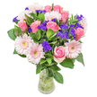There is a gentle poetry woven into this arrangement-a dance of pale pink roses, each petal soft and luminous, mingling with dainty gerbera daisies that glow beside deep green foliage. The composition is more than a bouquet; it's an invitation to experience Tufnell Park's subtle beauty in bloom. Purple statice, vivid against pastel petals, brings a touch of playful spontaneity reminiscent of a stroll through the neighbourhood's lively side streets or a Sunday visit to the local flower stands. Every stem is chosen for its meaning and freshness by a Tufnell Park florist who understands the area's understated elegance. The overall effect is airy yet abundant, as if caught in soft spring light-perfect for a birthday, to say congratulations, or as a tender gesture when words are not enough. Each floral detail, from the silken touch of a rose to the woodland scent drifting from the foliage, is arranged to ensure that whoever receives it feels genuinely cherished in the heart of Tufnell Park.