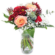 Vivid and heartfelt, this Tufnell Park bouquet captures attention with its deep, velvety reds and softly glowing peach undertones, reminiscent of a sunrise watched from the slopes of Highgate Hill. The focal point is a trio of apricot-pink roses, their petals softly layered with a satiny sheen that warms the eye and heart alike. These are encircled by sumptuous burgundy chrysanthemums, whose lush, tactile petals bring both depth and drama-inviting the viewer to imagine their cool, rich texture. Wisps of baby's breath create frilled rings of airy whiteness, lending the bouquet a dreamy, almost celebratory finish. Glossy green leaves and arched sprigs of eucalyptus weave throughout, adding not only contrasting colour and shape, but also a hint of fresh, invigorating aroma that calls to mind the nearby Tufnell Park gardens after an early rain. Every detail is illuminated by bright, natural light, and the clear vase underneath reveals a natural, almost untamed arrangement of stems, bringing authenticity and gentle movement. Ideal as a romantic surprise, a birthday gesture, or a moment of sincere connection, this bouquet brings the energy and charm of Tufnell Park's community into any home, complemented by the promise of freshness and expert local delivery.
